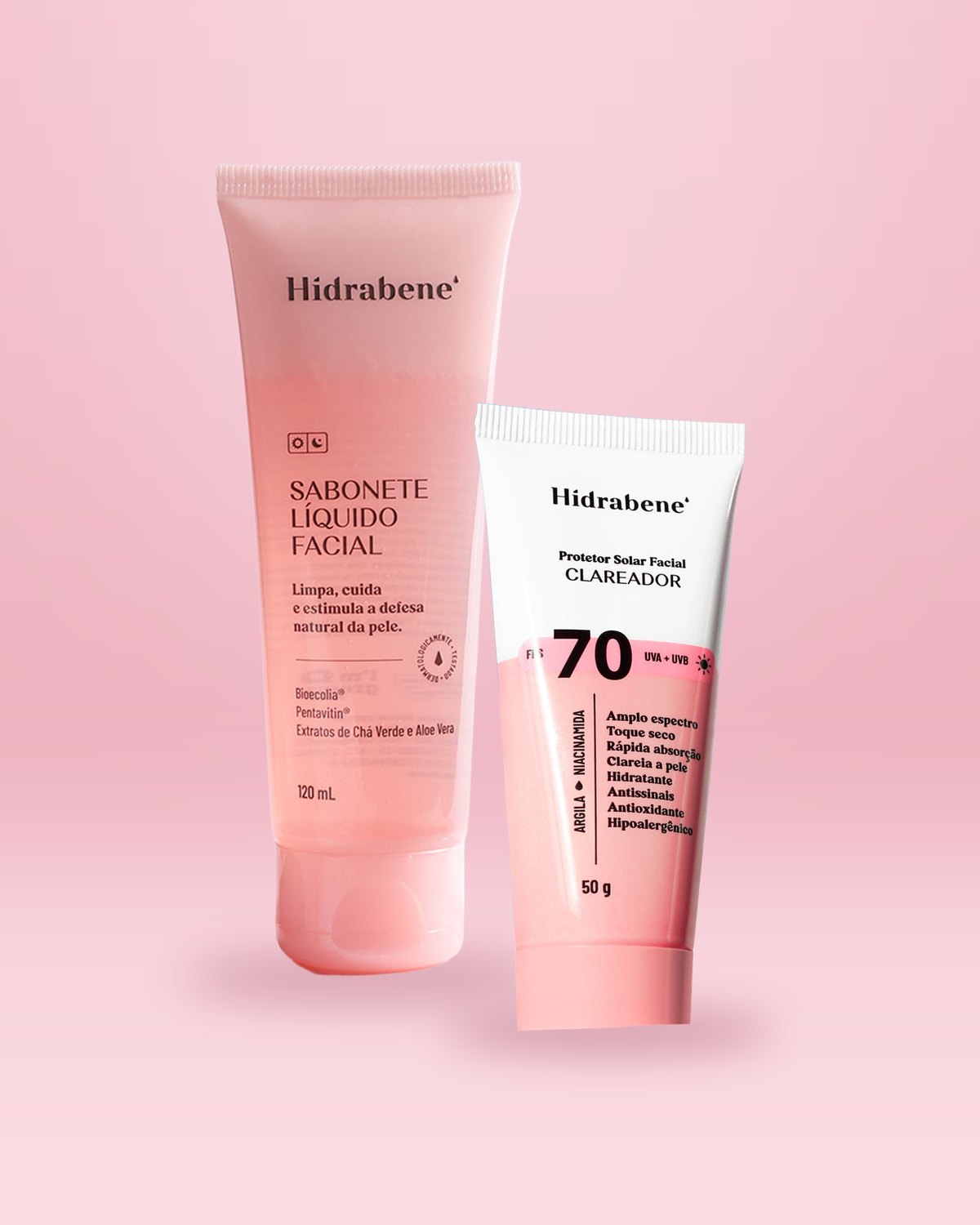 Bisnaga do Sabonete Líquido Facial 120ml ao lado da bisnaga do Protetor Solar FPS 70 Clareador 50g, em fundo rosa