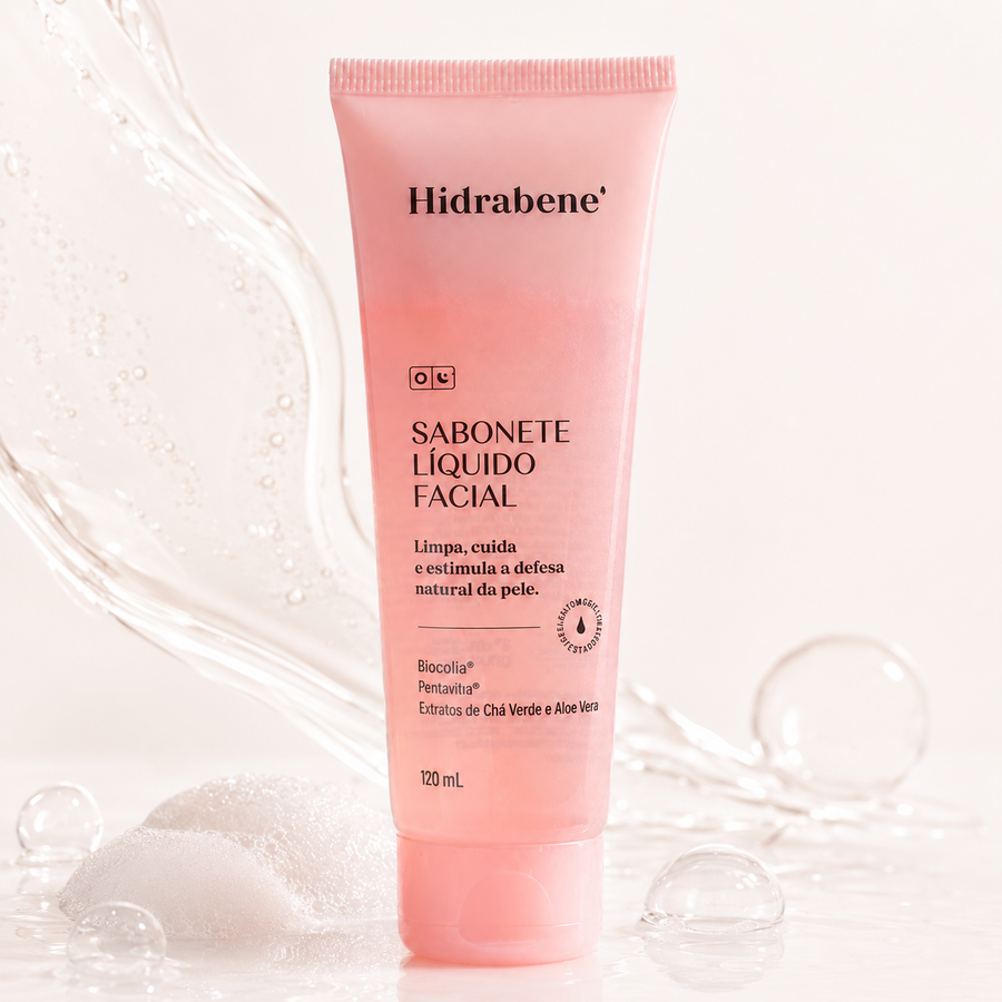 Bisnaga rosa do Sabonete Líquido Facial Hidrabene sobre um respingo de água.