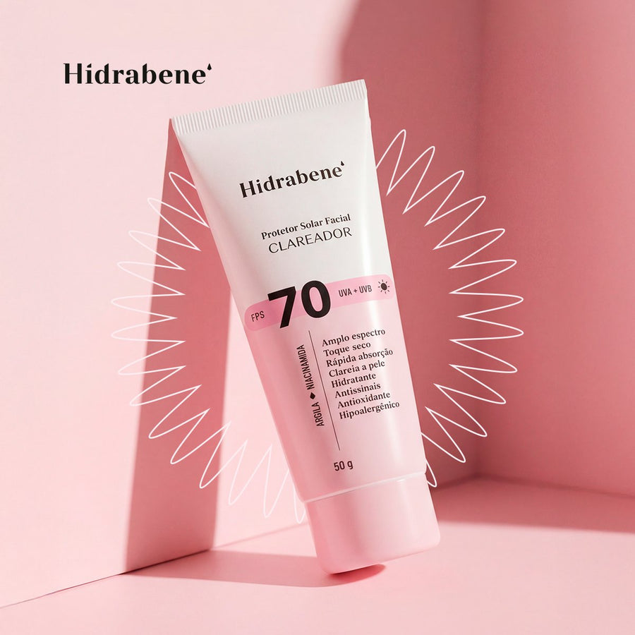 Bisnaga do Protetor Solar Facial FPS 70 Clareador Hidrabene deitada sobre um risco de creme.