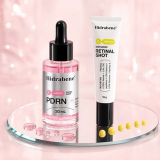 Sérum PDRN e Retinal Shot numa bandeja espelhada com gotas rosa e amarelas